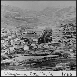 A black and white ariel photo of Virginia City in a valley